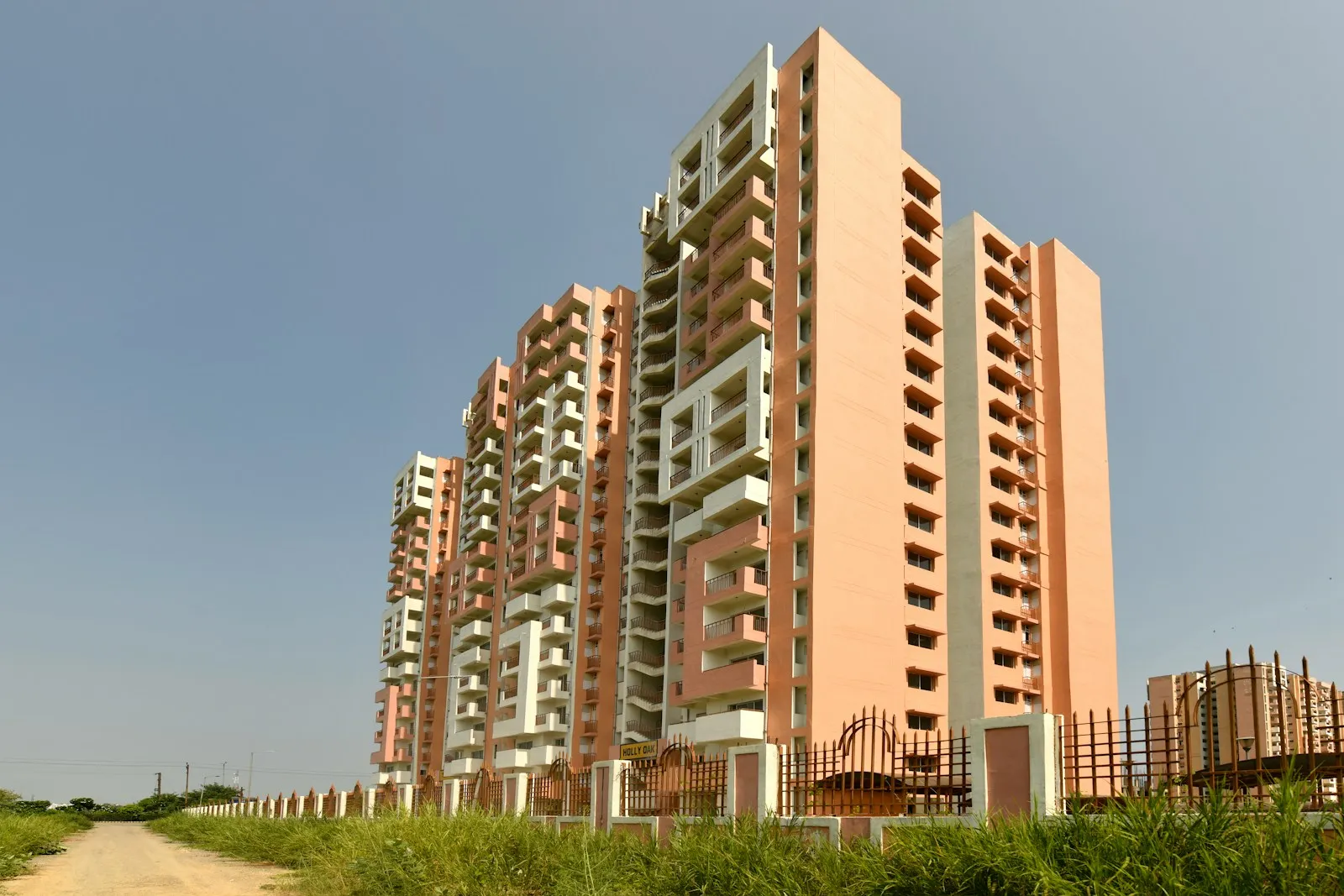 Tall apartment buildings under a clear blue sky