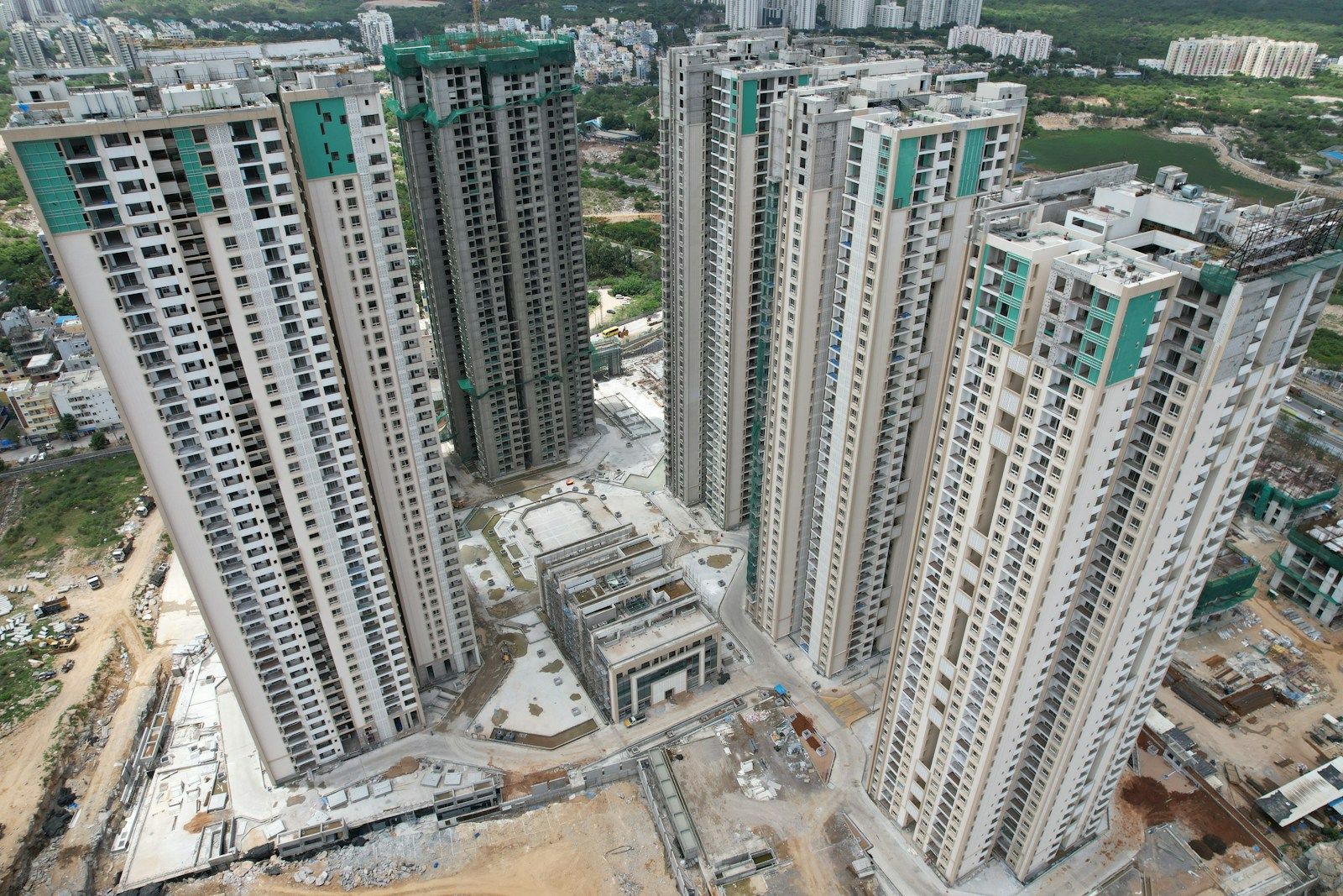 Aerial view of new residential towers rising above a growing neighbourhood