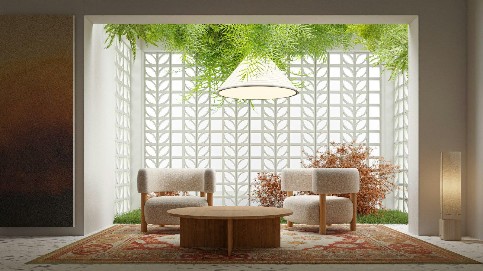 Sitting area with two armchairs in front of a patterned screen wall